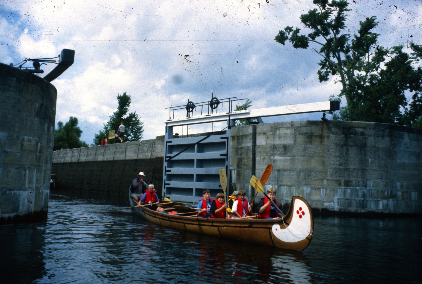 Young campers in war canoes on the Rideau Canal Sea Doo Tour